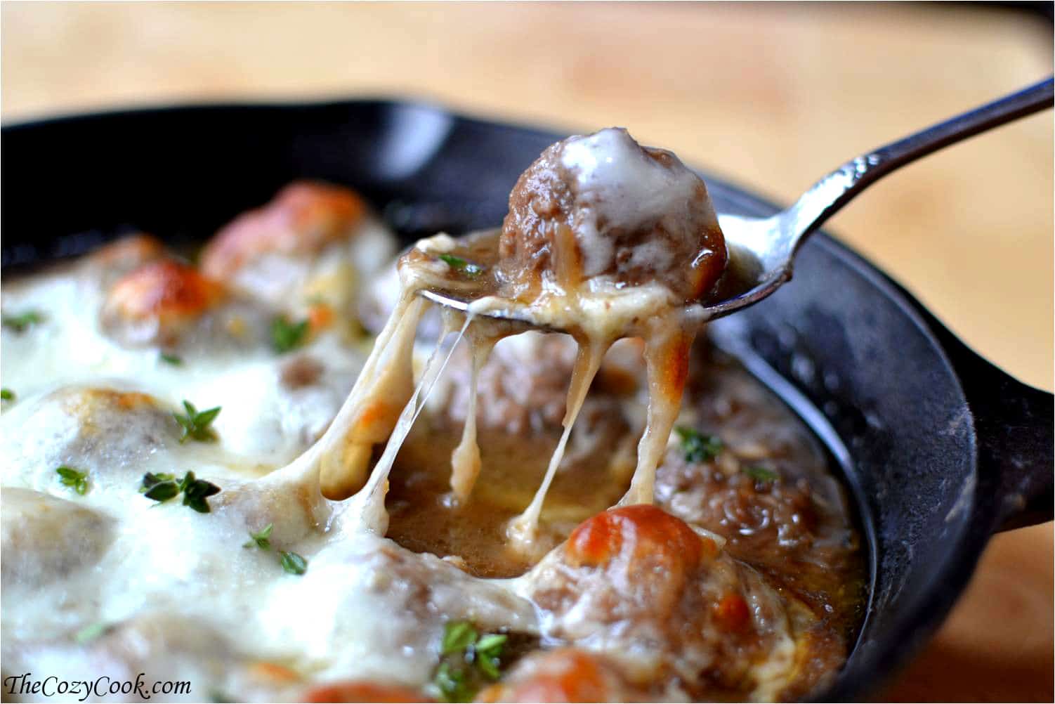 These meatballs are doused in rich caramelized onion sauce and topped with hot, melted cheese. They'll be the best meatballs you've ever had French Onion Soup Meatball