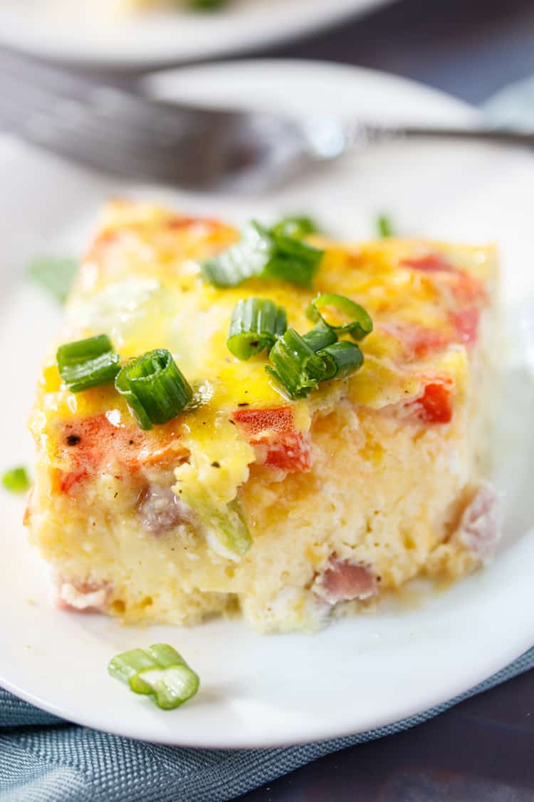This Denver Omelette Egg Bake is loaded with ham, bell peppers, onions and cheese mixed with fluffy eggs and ready in 30 minutes from start to finish! Egg Bake